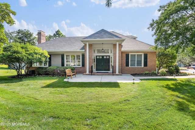 34 Peach Tree Ln, Little Silver, NJ 07739 - view of front of property featuring a front lawn, brick siding, and a chimney