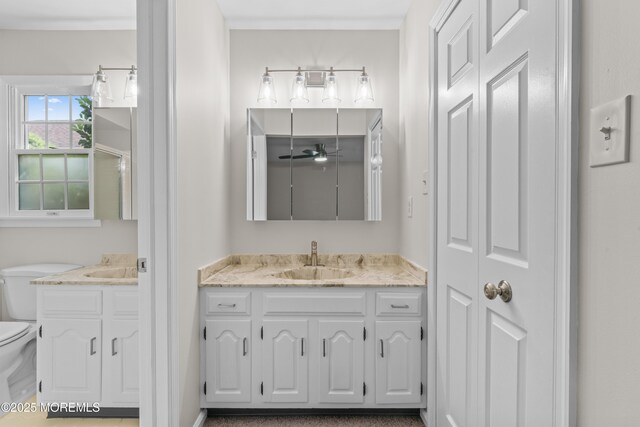 1776 Buttonwood Ave, Toms River, NJ 08755 - full bath with toilet, two vanities, and ceiling fan