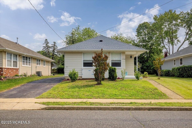 1936 Yorktowne Blvd, Toms River, NJ 08753 - bungalow-style house featuring a front lawn and central AC