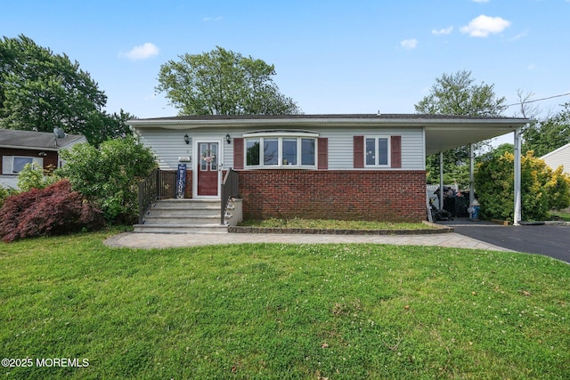 9 W Susan St, Hazlet, NJ 07730 - view of front of house featuring brick siding, a front yard, and driveway