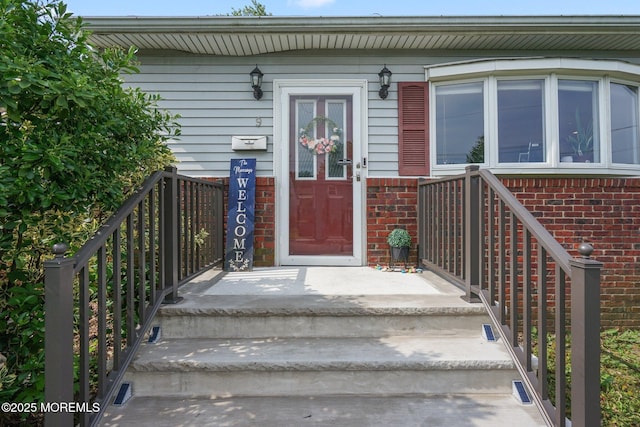 9 W Susan St, Hazlet, NJ 07730 - doorway to property featuring brick siding