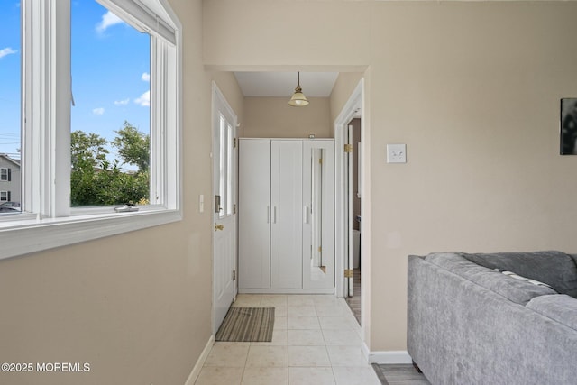 9 W Susan St, Hazlet, NJ 07730 - doorway with healthy amount of natural light, baseboards, and light tile patterned floors