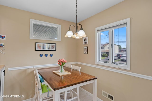 9 W Susan St, Hazlet, NJ 07730 - dining area with a chandelier and baseboards