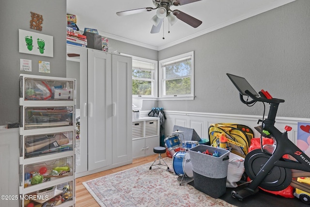 9 W Susan St, Hazlet, NJ 07730 - recreation room featuring light wood-type flooring, crown molding, ceiling fan, and wainscoting