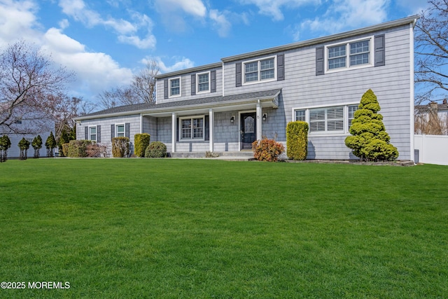 6 Kenneth Dr, Ocean Twp, NJ 07712 - view of front of home with a front yard and a porch