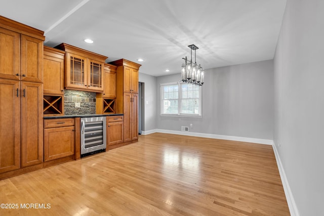 6 Kenneth Dr, Ocean Twp, NJ 07712 - indoor dry bar with beverage cooler, tasteful backsplash, baseboards, light wood-type flooring, and recessed lighting
