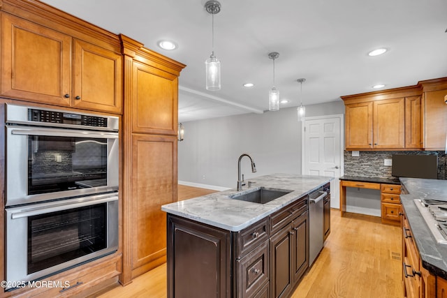 6 Kenneth Dr, Ocean Twp, NJ 07712 - kitchen featuring appliances with stainless steel finishes, a sink, recessed lighting, light wood-style floors, and decorative backsplash
