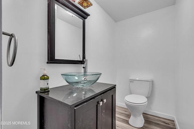 6 Kenneth Dr, Ocean Twp, NJ 07712 - half bath featuring wood finished floors, toilet, vanity, and baseboards