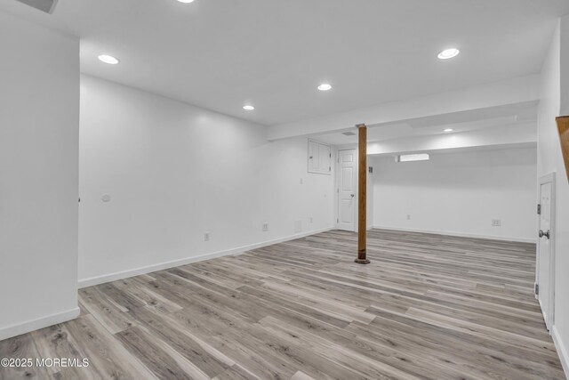 6 Kenneth Dr, Ocean Twp, NJ 07712 - finished below grade area featuring recessed lighting, light wood-type flooring, and baseboards