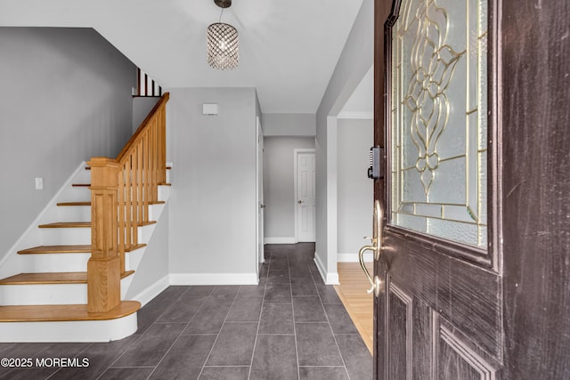 6 Kenneth Dr, Ocean Twp, NJ 07712 - entryway featuring stairway, dark tile patterned floors, and baseboards