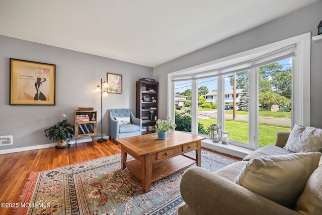 67 Koenig Ln, Freehold, NJ 07728 - living room featuring wood finished floors and baseboards