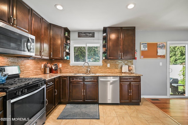 67 Koenig Ln, Freehold, NJ 07728 - kitchen with appliances with stainless steel finishes, a sink, open shelves, healthy amount of natural light, and recessed lighting