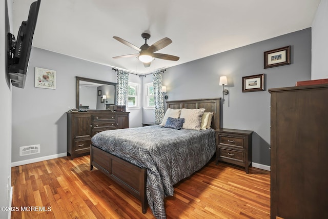 67 Koenig Ln, Freehold, NJ 07728 - bedroom with baseboards, light wood finished floors, and a ceiling fan