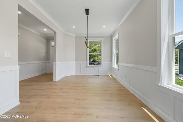 783 Delaware Ave, Manahawkin, NJ 08050 - unfurnished dining area with ornamental molding, light wood finished floors, wainscoting, a decorative wall, and recessed lighting