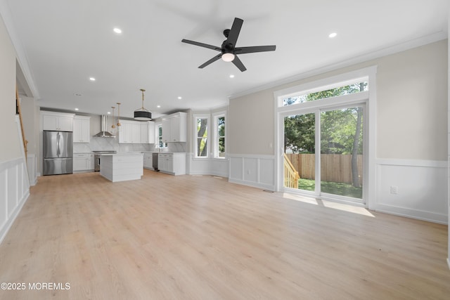 783 Delaware Ave, Manahawkin, NJ 08050 - unfurnished living room with ornamental molding, a decorative wall, recessed lighting, a ceiling fan, and a wainscoted wall