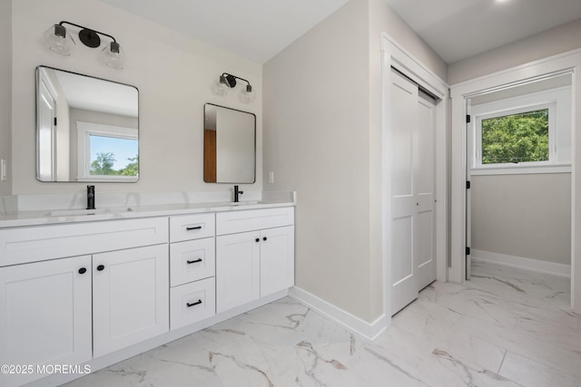 783 Delaware Ave, Manahawkin, NJ 08050 - bathroom featuring baseboards, marble look tile flooring, and double vanity