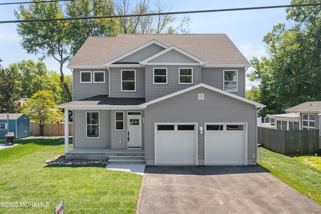 783 Delaware Ave, Manahawkin, NJ 08050 - view of front of home featuring roof with shingles, asphalt driveway, board and batten siding, a porch, and a storage shed
