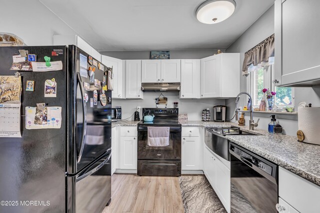 235 Columbine Ave Unit A, Whiting, NJ 08759 - kitchen with black appliances, under cabinet range hood, a sink, and white cabinetry