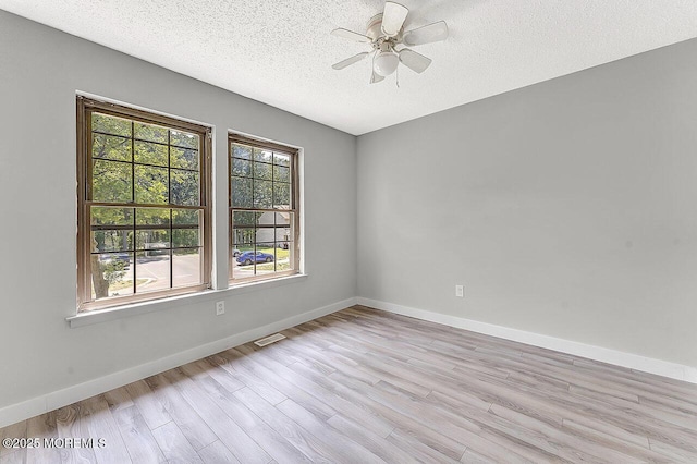 112 Azalea Cir, Jackson, NJ 08527 - empty room with light wood finished floors, a textured ceiling, a ceiling fan, and baseboards