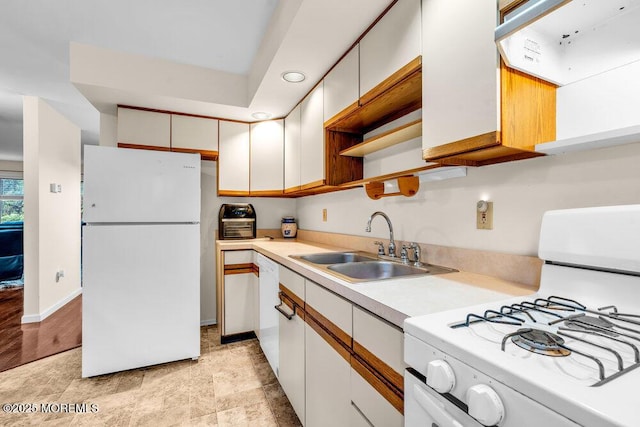 1202 Alpine Trl, Neptune Township, NJ 07753 - kitchen featuring white appliances, light countertops, a sink, white cabinetry, and baseboards
