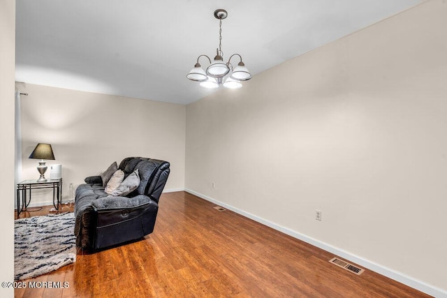 1202 Alpine Trl, Neptune Township, NJ 07753 - sitting room featuring a chandelier, baseboards, and wood finished floors