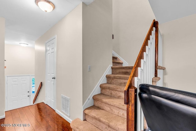 1202 Alpine Trl, Neptune Township, NJ 07753 - foyer entrance with stairs, wood finished floors, and baseboards