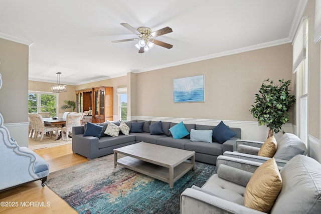 7 Cranberry Ct, Haledon, NJ 07508 - living room with wood finished floors, a ceiling fan, crown molding, and a chandelier