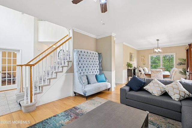 7 Cranberry Ct, Haledon, NJ 07508 - living room featuring wood finished floors, stairway, a chandelier, crown molding, and a ceiling fan