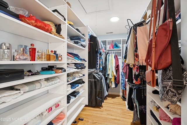 7 Cranberry Ct, Haledon, NJ 07508 - walk in closet with attic access and light wood-style floors