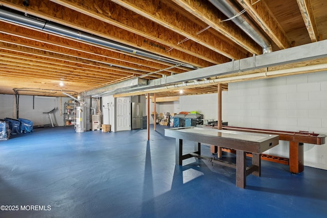 7 Cranberry Ct, Haledon, NJ 07508 - unfinished basement with water heater, freestanding refrigerator, and concrete block wall