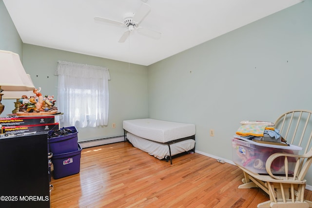 62 Virgin Islands Dr, Toms River, NJ 08757 - bedroom with a baseboard radiator, wood finished floors, ceiling fan, and baseboards