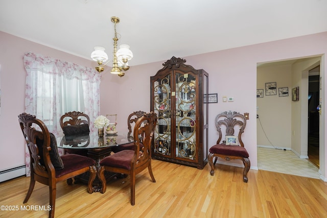 62 Virgin Islands Dr, Toms River, NJ 08757 - dining space featuring a chandelier, wood finished floors, a baseboard radiator, and baseboards