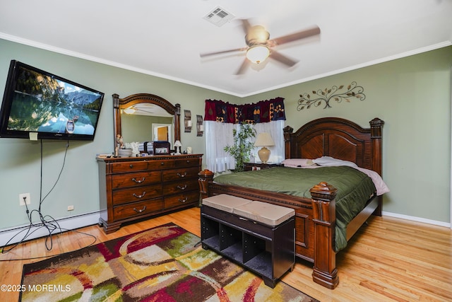 62 Virgin Islands Dr, Toms River, NJ 08757 - bedroom featuring baseboard heating, crown molding, light wood-type flooring, baseboards, and ceiling fan