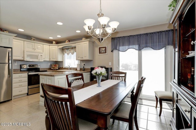 648 Pulham Ct Unit B, Manchester, NJ 08759 - dining area with light tile patterned flooring, a chandelier, and recessed lighting