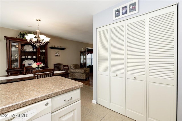 648 Pulham Ct Unit B, Manchester, NJ 08759 - kitchen with dishwasher, light countertops, light tile patterned floors, a chandelier, and hanging light fixtures