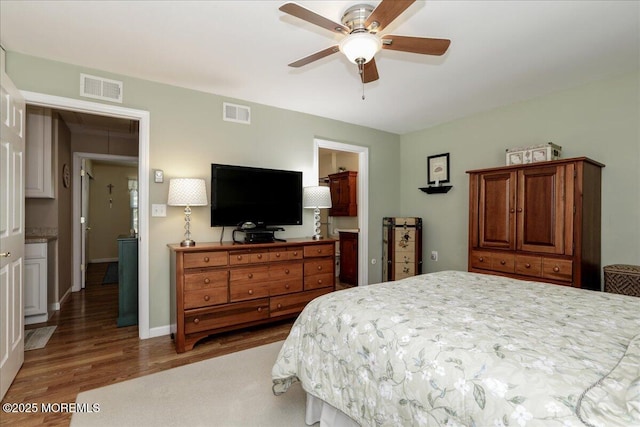 648 Pulham Ct Unit B, Manchester, NJ 08759 - bedroom with wood finished floors, a ceiling fan, ensuite bath, and baseboards