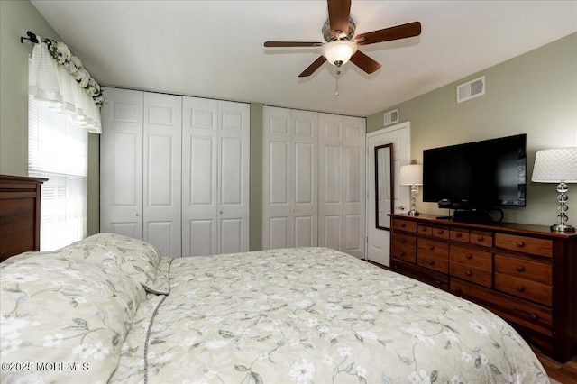 648 Pulham Ct Unit B, Manchester, NJ 08759 - bedroom with two closets, a ceiling fan, and wood finished floors