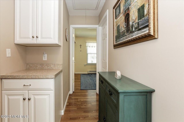648 Pulham Ct Unit B, Manchester, NJ 08759 - hallway with attic access, wood finished floors, a baseboard heating unit, and baseboards