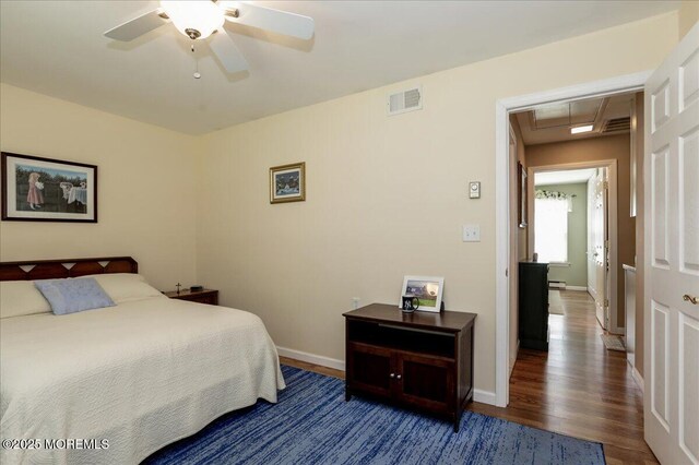 648 Pulham Ct Unit B, Manchester, NJ 08759 - bedroom featuring wood finished floors, attic access, baseboard heating, a ceiling fan, and baseboards
