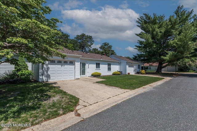 648 Pulham Ct Unit B, Manchester, NJ 08759 - ranch-style home featuring a garage, driveway, and a front lawn
