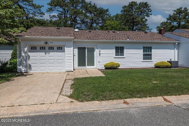648 Pulham Ct Unit B, Manchester, NJ 08759 - single story home with concrete driveway, an attached garage, a front yard, central AC, and a shingled roof
