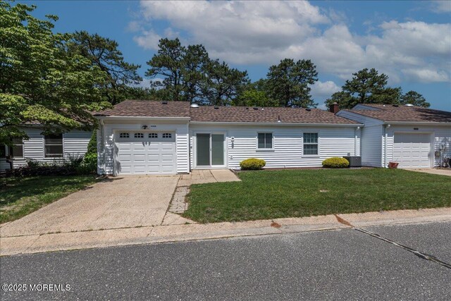 648 Pulham Ct Unit B, Manchester, NJ 08759 - single story home with a garage, driveway, a front lawn, and cooling unit