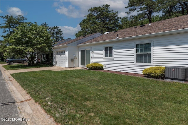 648 Pulham Ct Unit B, Manchester, NJ 08759 - ranch-style house with central AC unit, concrete driveway, a garage, a front yard, and a shingled roof