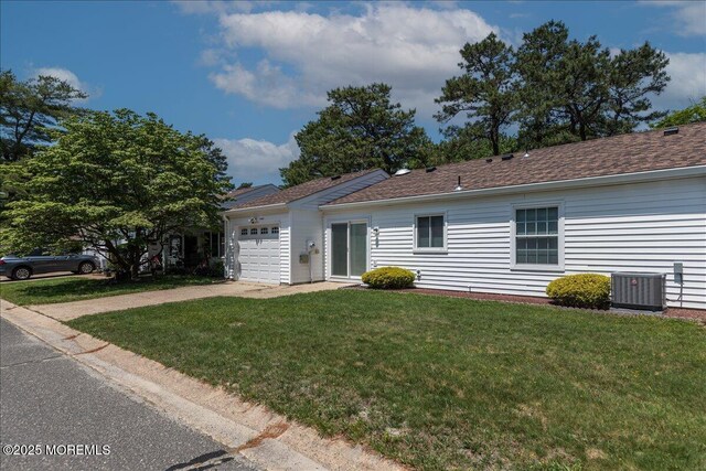 648 Pulham Ct Unit B, Manchester, NJ 08759 - ranch-style home with central air condition unit, driveway, a garage, and a front lawn