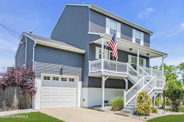 913 Lorillard Ave, Union Beach, NJ 07735 - view of front of property featuring a garage, a porch, concrete driveway, and stairway