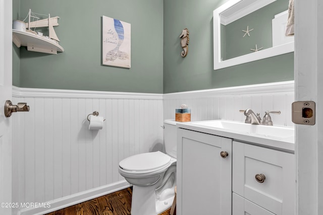 913 Lorillard Ave, Union Beach, NJ 07735 - bathroom with a wainscoted wall, toilet, vanity, and wood finished floors