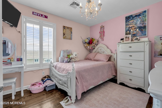 913 Lorillard Ave, Union Beach, NJ 07735 - bedroom featuring a chandelier, wood finished floors, and baseboards