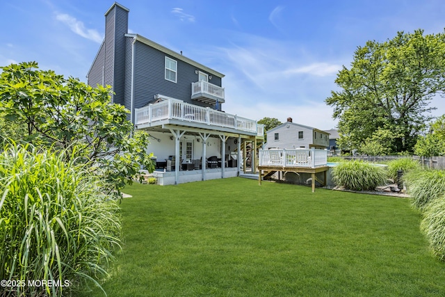 913 Lorillard Ave, Union Beach, NJ 07735 - rear view of house featuring a wooden deck, a chimney, a yard, and a patio