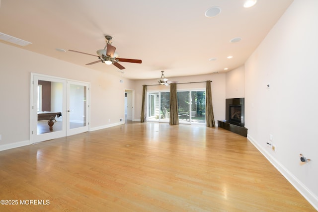 324 Magnolia Ave, Brielle, NJ 08730 - unfurnished living room featuring french doors, a glass covered fireplace, ceiling fan, light wood-type flooring, and recessed lighting