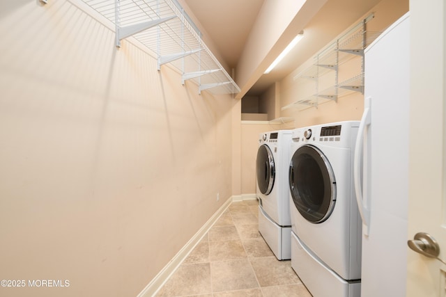 324 Magnolia Ave, Brielle, NJ 08730 - washroom with washing machine and clothes dryer and light tile patterned flooring